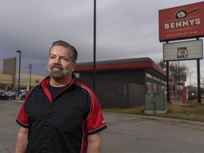 Bennys Breakfast Bar owner Kevin Young poses for a photo outside his restaurant in Calgary on Friday, April 9, 2021.