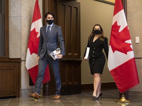Prime Minister Justin Trudeau arrives with Chrystia Freeland,  deputy prime minister and minister of finance, as she prepares to table the federal budget in the House of Commons in Ottawa, on Monday, April 19, 2021.