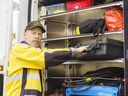 Bill Hossack, a search manager with Calgary Search and Rescue Association, grabs equipment from a CALSARA van in Calgary on Friday, April 9, 2021.