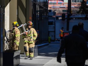 Firefighters respond to a call at Fifth Avenue Place in downtown Calgary on Tuesday, April 13, 2021.
