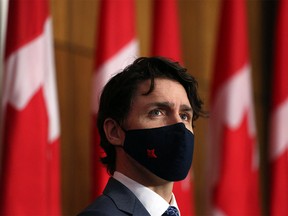 In this file photo taken on April 16, 2021 Canadian Prime Minister Justin Trudeau listens to a reporter's question during a news conference in Ottawa, Canada.