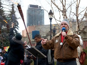 Artur Pawlowski, the pastor of Calgary's Street Church speaks to members of the church as attendees of a Protest Against Racism and members of the Street Church clash while police keep both group separated at Olympic Plaza. Sunday, April 4, 2021.