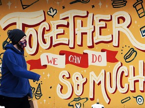 A pedestrian walks past a hopeful mural on the The Blue Store food mart in Inglewood on Wednesday, Feb. 17, 2021. 

Gavin Young/Postmedia