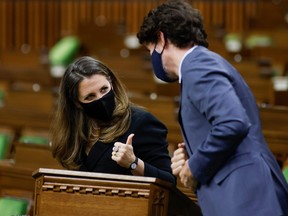 Canada's Finance Minister Chrystia Freeland gives a thumbs up to Prime Minister Justin Trudeau in the House of Commons on Parliament Hill in Ottawa, Ontario, Canada, April 19, 2021.