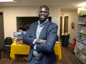 Gar Gar with the Youth Empowerment and Skills Charity poses with donated computers in the Forest Lawn Community Centre. The charity is working to provide donated computers and devices for students who lack access to technology and online learning capabilities at home during the pandemic. Tuesday, April 20, 2021.