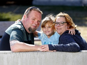 Dave Murphy with his wife Kim and daughter Chloe, 6. Murphy was nearly fatally stabbed to death in 1994 in Ottawa and is seeking the paramedics who saved his life in Calgary. Photo taken on Tuesday, April 13, 2021.