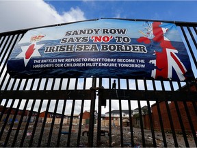 A banner on a gate on Sandy Row street is pictured, following a week of violence, in Belfast, Northern Ireland, April 9, 2021. REUTERS/Jason Cairnduff