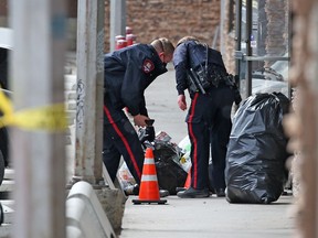 Orange cones mark where shell casings lie at a scene where gunshots were fired outside the Money Back Bottle Depot on 37th Street S.W. on Thursday, April 8, 2021. There were no injuries in the incident.