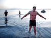 Adam Kreek (centre), Fraser Thomson and Patrick Walter exit the water at Mt. Douglas Park in Victoria on March 26.