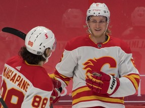 Feb 27, 2021; Ottawa, Ontario, CAN; Calgary Flames defenseman Juuso Valimaki (6) celebrates with left wing Andrew Mangiapane (88) after scoring a goal against the Ottawa Senators in the first period at the Canadian Tire Centre. Mandatory Credit: Marc DesRosiers-USA TODAY Sports ORG XMIT: IMAGN-445244