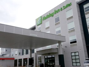 A Calgary woman left the Holiday Inn on Blackfoot Trail last weekend after she says she met another hotel guest leaving the elevator who was staying there as part of the province's isolation hotel program.