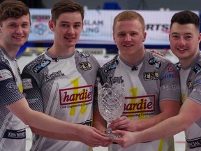 Skip Bruce Mouat, third Grant Hardie, second Bobby Lammie and lead Hammy McMillan Jr. hold the trophy after capturing the Pinty's Grand Slam of Curling Humpty's Champions Cup men's title at WinSport's Markin MacPhail Centre in Calgary on Monday, April 19, 2021. Mike Cleasby/Grand Slam of Curling