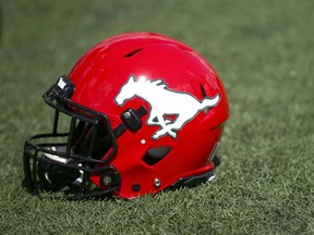 A Calgary Stampeders helmet is shown on the field prior to CFL action against the Ottawa Redblacks on June 15/ 19. Jim Wells/Postmedia