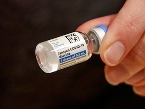A nurse displays a Johnson & Johnson COVID-19 vial at a vaccination centre in Chicago.