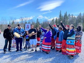 Family and friends gather on April 28, 2021, to remember Keesha Faith Crawler at the site near Highway 1A on the Stoney Nakoda First Nations where her body was found 10 days ago.