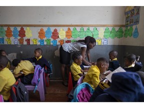 Kwanele Nkala teaches her five-year-old students at a primary school in Yeoville, a district of Johannesburg. Kwanele left Zimbabwe, where she studied to be a teacher, and was recruited to work at this school intended primarily for migrant children, who often are unwelcome at public schools. Photo by Miora Rajaonary. Photos and caption courtesy of National Geographic.