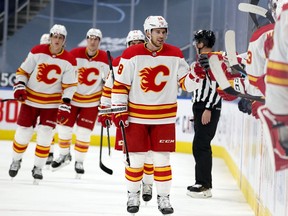 The Calgary Flames’ Elias Lindholm (28) celebrates a goal against the Edmonton Oilers at Rogers Place in Edmonton on Thursday April 29, 2021.