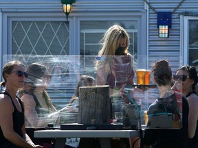 People enjoy the spring weather on the patio at the Cold Garden Beverage Company in Inglewood. Friday, April 30, 2021.