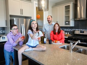 Aimee and Gareth Igloliorte and their children Isla, 8, and Oliver, 13, love their new home in Precedence, in Cochrane, by Douglas Homes.