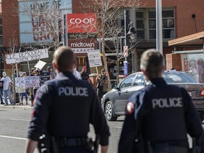 Calgary police were present as a group of people gathered outside the Co-op Midtown to protest the COVID-19 restrictions on Wednesday, May 5, 2021.
