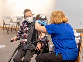 Riley Oldford, a 16-year-old who has cerebral palsy, is the first N.W.T. youth to get the Pfizer vaccine. He received the needle from Nurse practitioner Janie Neudorf in Yellowknife on Thursday, May 6, 2021.