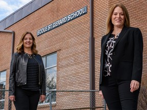 STEM Innovation Academy co-founders Lisa Davis, left, and Sarah Bieber pose for a photo outside their charter school’s new location on Thursday, May 13, 2021.