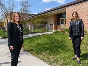STEM Innovation Academy co-founders Sarah Bieber, left, and Lisa Davis pose for a photo outside their charter school’s new location on Thursday, May 13, 2021.