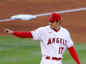 Los Angeles Angels star Shohei Ohtani reacts after Franmil Reyes of the Cleveland Indians is called out at third base during the fourth inning at Angel Stadium of Anaheim on May 19.