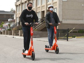Ward 8 Councillor Evan Woolley joins Ankush Karwal from Neuron Mobility during a demonstration of e-scooters in Calgary on Friday, May 28, 2021. Two companies, Bird and Neuron demonstrated the e-scooters.