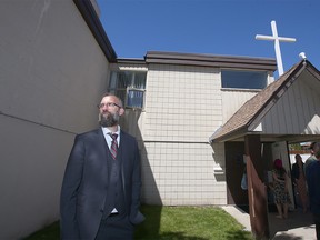 Pastor Tim Stephens waits outside Fairview Baptist Church after the Sunday service in Calgary on Sunday, May 30, 2021. Police and AHS visited the church and spoke to representatives.