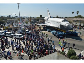 On this day in history in 2011, the Space Shuttle Endeavour wrapped up its last mission, landing safely on earth. The youngest of the shuttles , itlogged 198 million kilometres over 25 flights in 19 years.
Space Shuttle Endeavour is shown here travelling through Los Angeles on October 13, 2012. The 170,000-pound (77,272 kg) shuttle travelled at no more than 3.2 km per hour along a 19-kilometre route to its final home at the California Science Center.   AFP PHOTO / Jeff Gritchen /  GettyImages.