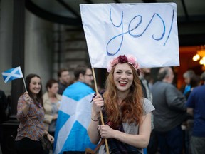 "Yes" campaign supporter for Scottish independence waves a flag outside Usher Hall ahead of the "A Night for Scotland" concert in Edinburgh on September 2014.