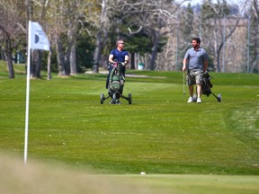 Golfers play at Shaganappi Point Golf Course on Thursday, May 6, 2021. Starting next week pandemic restrictions will limit tee time bookings to members of the same household or, if living alone, individuals plus their two close contacts.
Gavin Young/Postmedia