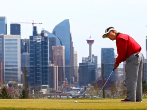 Leo Lee warms up on the putting green before golfing at Shaganappi Point Golf Course on Thursday, May 6, 2021. Starting next week pandemic restrictions will limit tee time bookings to members of the same household or, if living alone, individuals plus their two close contacts.
Gavin Young/Postmedia