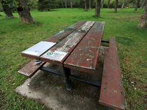 A picnic table in Elbow Park near the Elbow River is marked as one that is part of the alcohol in parks pilot project on Wednesday, May 26, 2021. The pilot runs from June 1 to Sept. 7, 2021 and will permit Calgarians to drink alcohol at 30 marked and designated tables between 11 a.m. and 9 p.m.