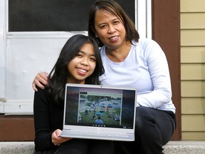 Mom Zelna Robles with her daughter Julianne, 12, a Grade 7 student who received a new Chromebook this week thanks to the Calgary YES Centre on Tuesday, May 11, 2021.