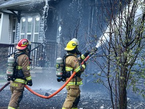 Fire crews battle a fire that damaged multiple homes along Skyview Spring Cres. N.E. Tuesday, May 18, 2021.