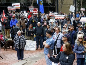 Protesters rally against COVID-19 restrictions outside McDougall Centre in Calgary on Tuesday, May 4, 2021.