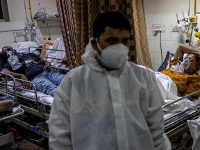 People suffering from the coronavirus disease (COVID-19) are treated inside an overcrowded casualty ward at a hospital in New Delhi, India, May 1, 2021.