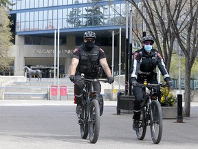 Calgary police patrol Stephen Avenue mall in downtown Calgary on Monday, May 3, 2021.