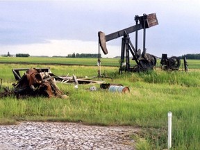 Abandoned oil well equipment sits on a farm near Legal, Alta.