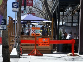 People are seen enjoying the patio at The Living Room on 17th Ave. SW. Sunday, May 2, 2021.