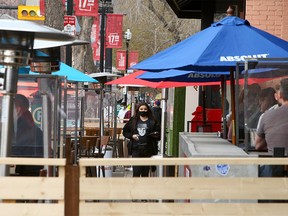 People are seen enjoying the patio at Trolley 5 Restaurant & Brewery on 17th Ave. SW. Tuesday, May 4, 2021.