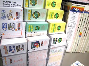 Lotto 6/49, Lotto Max and other lottery tickets on display at a retail outlet.