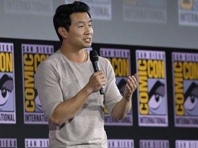 Canadian actor Simu Liu speaks on stage for the Marvel panel in Hall H of the Convention Center during Comic Con in San Diego, California on July 20, 2019.