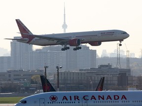 Air India flight 187 from New Delhi lands at Pearson Airport in Toronto on Friday, April 23, 2021. The flight was the last landing allowed after all flights from India and Pakistan to Canada were suspended.