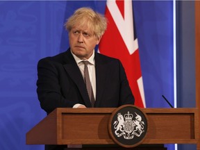 Britain's Prime Minister Boris Johnson attends a virtual news conference to announce changes to lockdown rules in England at Downing Street, in London, Britain May 10, 2021.