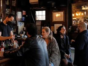 People gather at the White Horse Tavern (est. 1880) as restrictions eased on indoor drinking in bars, allowing seating at the bar, during the outbreak of the coronavirus disease (COVID-19) in Manhattan, New York City, New York, U.S., May 3, 2021.
