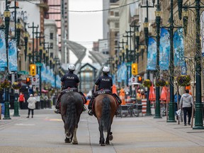 Calgary’s mounted police patrol Stephen Avenue on Friday, May 7, 2021.