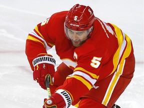 Calgary Flames Mark Giordano battles the Vancouver Canucks in first period NHL action at the Scotiabank Saddledome in Calgary on Wednesday, May 19, 2021. Darren Makowichuk/Postmedia